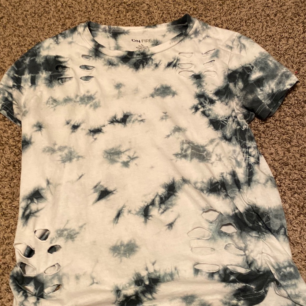 It’s a cute shirt with holes made into it more tight fit